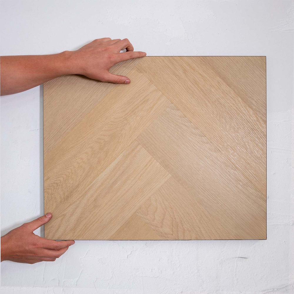 Full view of French Oak SPC Hybrid Floorboards Herringbone 7.5+2mm in French Oak colour warm tone herringbone flooring sample