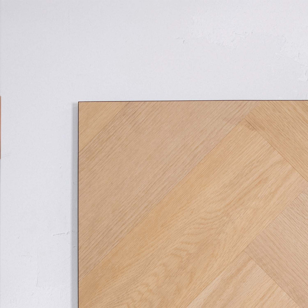 Profile view of French Oak SPC Hybrid Floorboards Herringbone 7.5+2mm in French Oak colour warm tone herringbone flooring sample