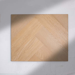 Front view of French Oak SPC Hybrid Floorboards Herringbone 7.5+2mm in French Oak colour warm tone herringbone flooring sample