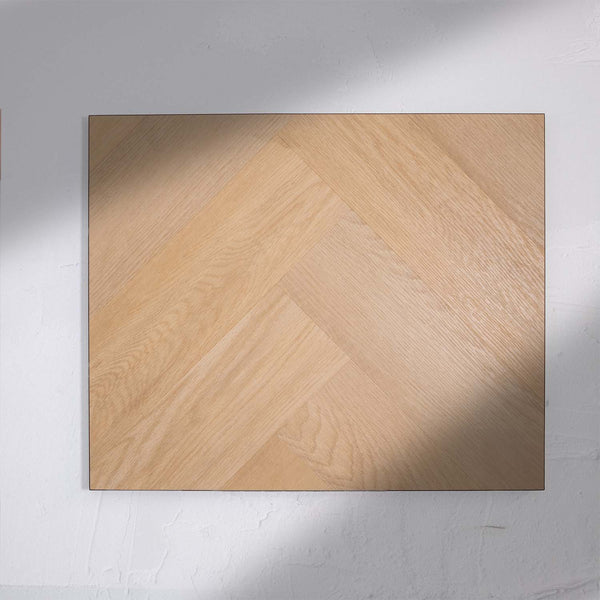 Front view of French Oak SPC Hybrid Floorboards Herringbone 7.5+2mm in French Oak colour warm tone herringbone flooring sample