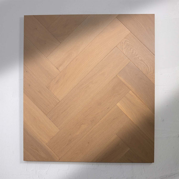 Perspective view of Light Malt Engineered Timber Herringbone 15.3mm in Light Malt colour light tone herringbone flooring sample