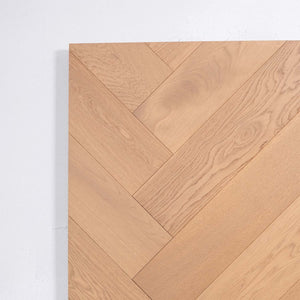 Angled view of Light Neutral Engineered Timber Herringbone 15.3mm in Light Neutral colour light tone herringbone flooring sample