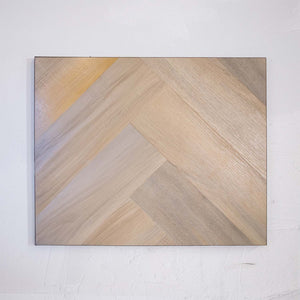 Angled view of Lime Ash SPC Hybrid Floorboards Herringbone 7.5+2mm in Lime Ash colour neutral tone herringbone flooring sample