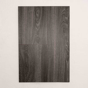 Flat lay of Midnight Oak Sterling Vinyl Plank 1220x229x3mm in Midnight Oak colour dark shade vinyl flooring plank sample