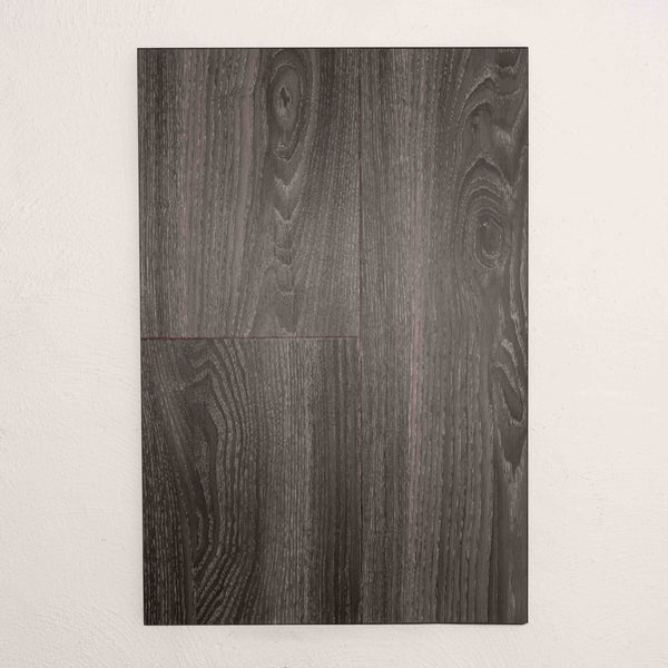 Flat lay of Midnight Oak Sterling Vinyl Plank 1220x229x3mm in Midnight Oak colour dark shade vinyl flooring plank sample