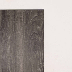Angled view of Midnight Oak Sterling Vinyl Plank 1220x229x3mm in Midnight Oak colour dark shade vinyl flooring plank sample