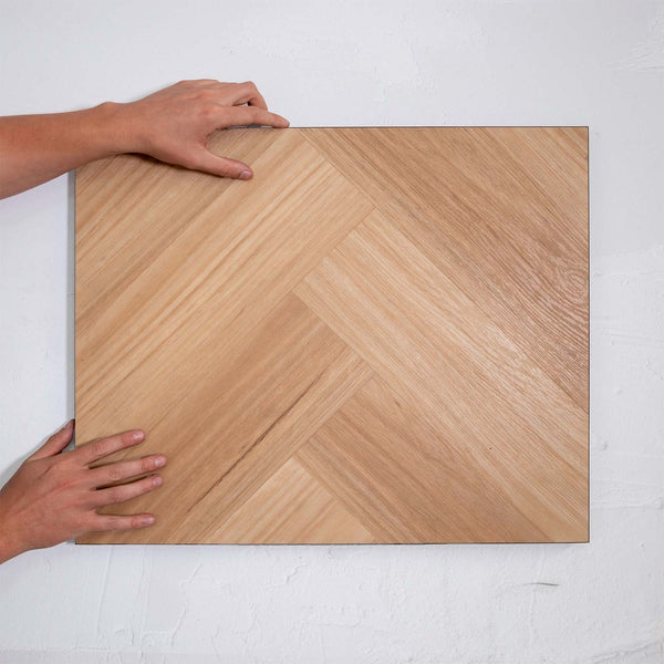 Perspective view of Natural Blackbutt SPC Hybrid Floorboards Herringbone 7.5+2mm in Natural Blackbutt colour dark shade herringbone flooring sample