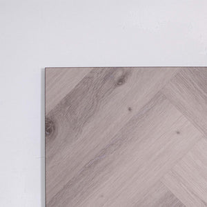 Side view of Snow Grey SPC Hybrid Floorboards Herringbone 7.5+2mm in Snow Grey colour light tone herringbone flooring sample