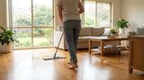 Damp-mopping a warm honey oak engineered timber floor with a microfibre mop