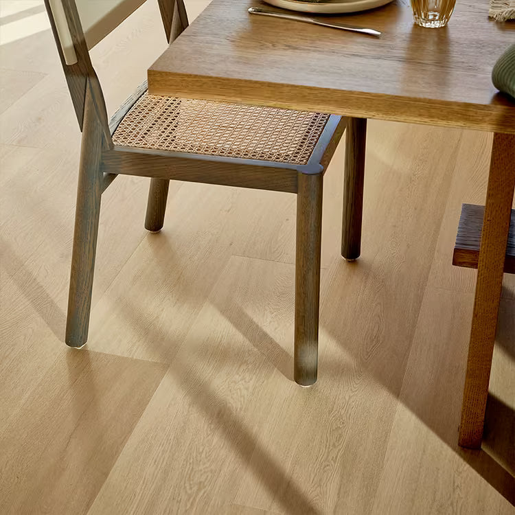 light room with neutral toned flooring and furniture.