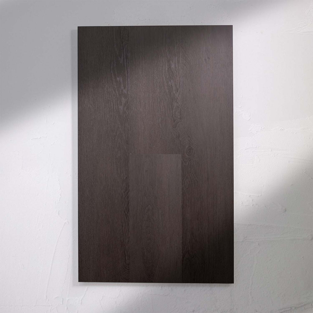 Angled view of Charcoal SPC Hybrid Floorboards 5+1.5mm in Charcoal colour dark shade hybrid flooring sample