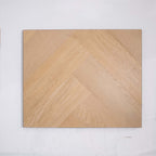 Flat lay of French Oak SPC Hybrid Floorboards Herringbone 7.5+2mm in French Oak colour warm tone herringbone flooring sample