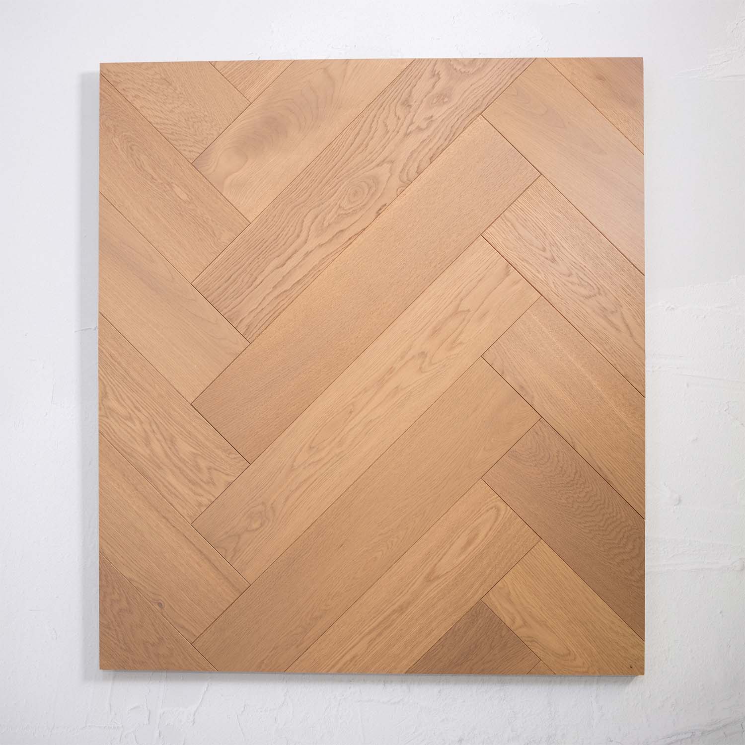 Detailed view of Light Neutral Engineered Timber Herringbone 15.3mm in Light Neutral colour light tone herringbone flooring sample