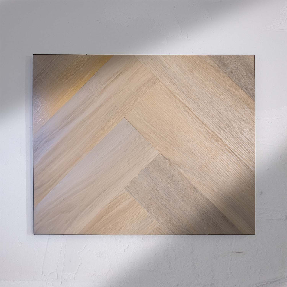 Flat lay of Lime Ash SPC Hybrid Floorboards Herringbone 7.5+2mm in Lime Ash colour neutral tone herringbone flooring sample