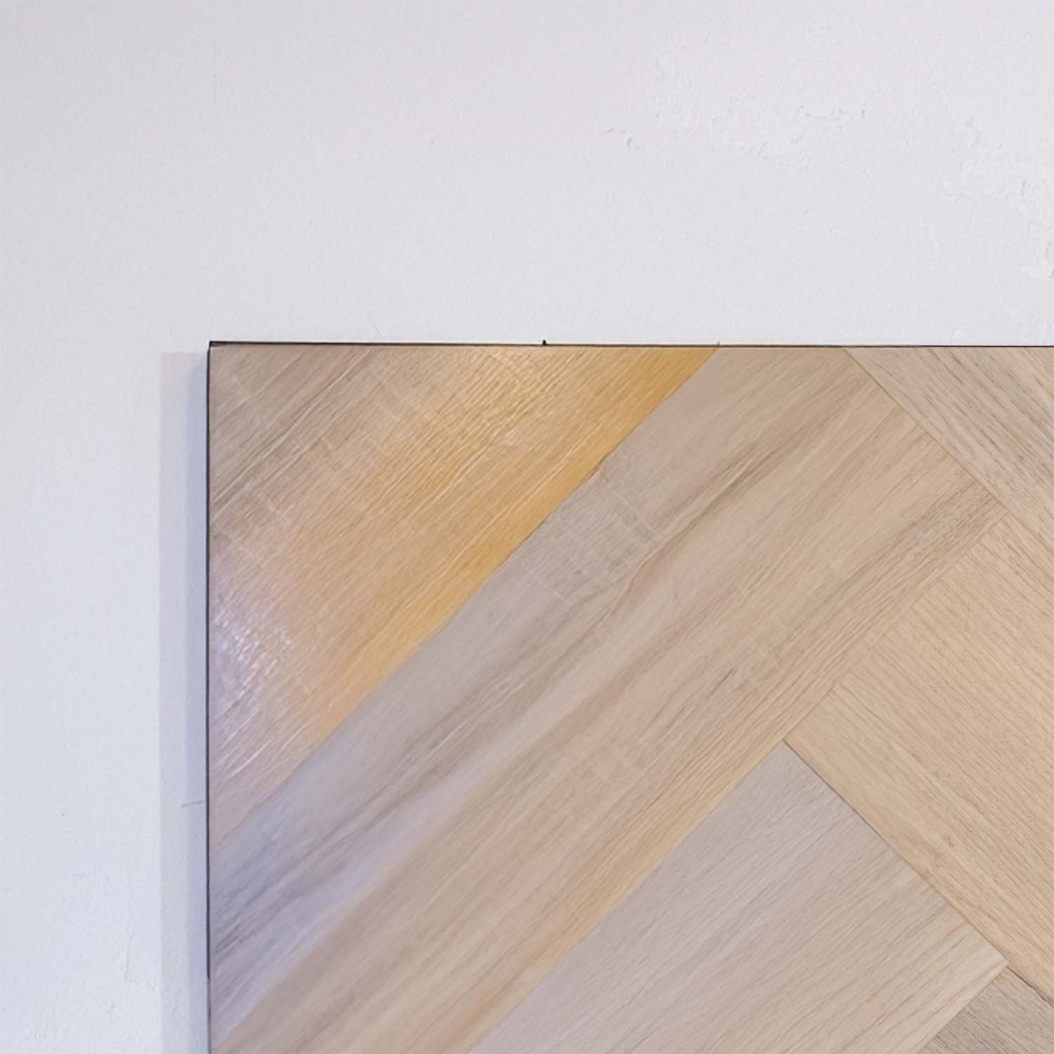 Flat lay of Lime Ash SPC Hybrid Floorboards Herringbone 7.5+2mm in Lime Ash colour neutral tone herringbone flooring sample