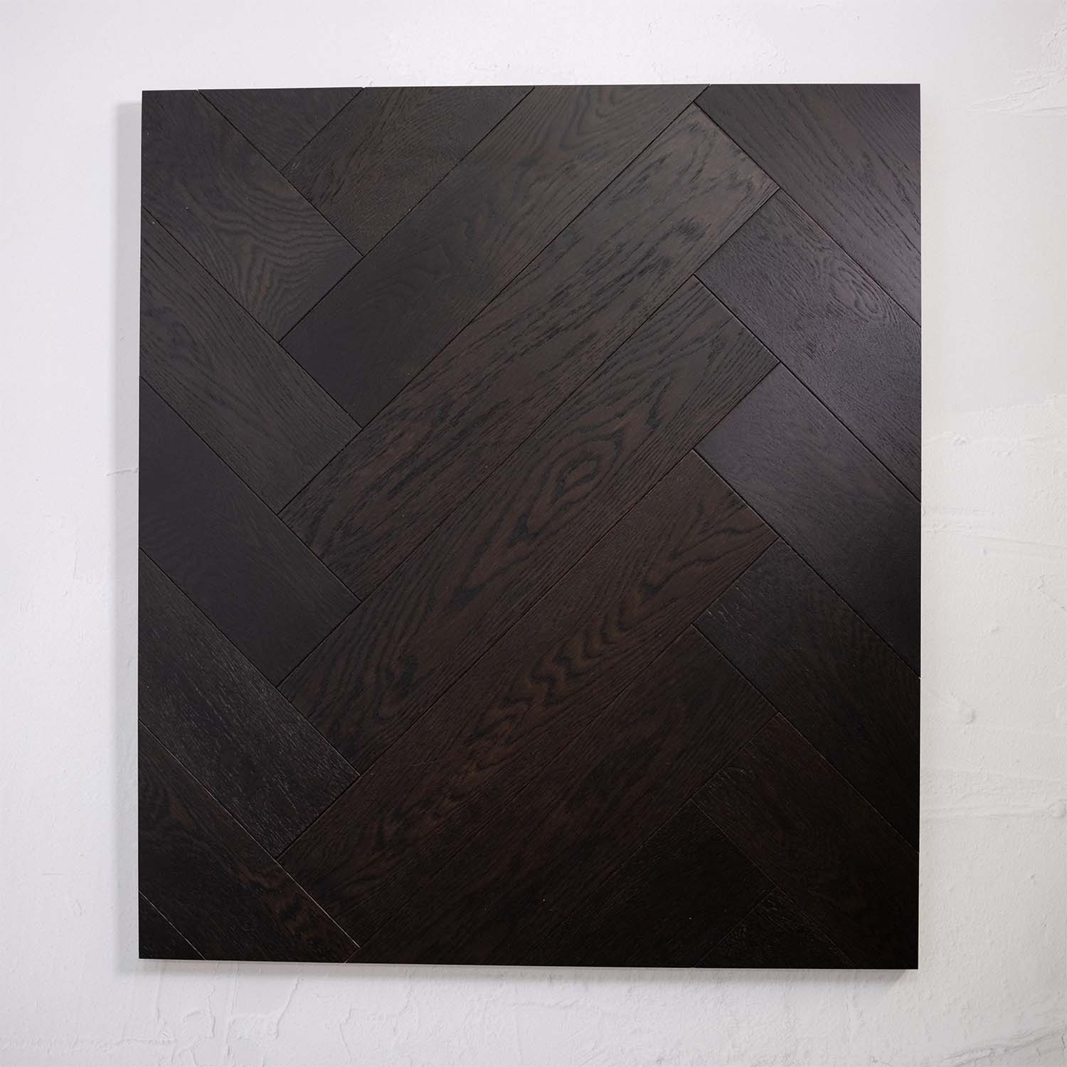 Side view of Midnight Grey Engineered Timber Herringbone 15.3mm in Midnight Grey colour dark shade herringbone flooring sample