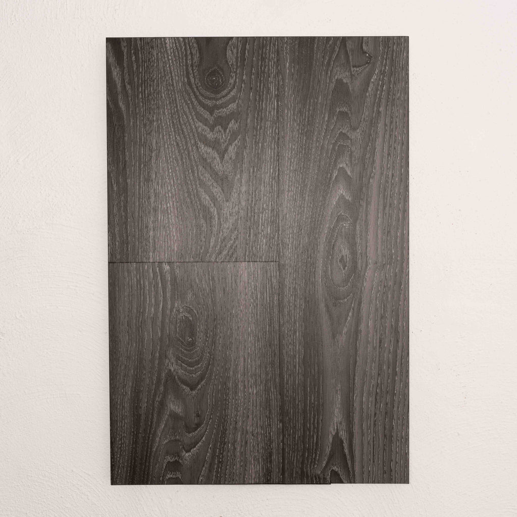 Flat lay of Midnight Oak Vision Vinyl 5mm in Midnight Oak colour dark shade vinyl flooring plank sample