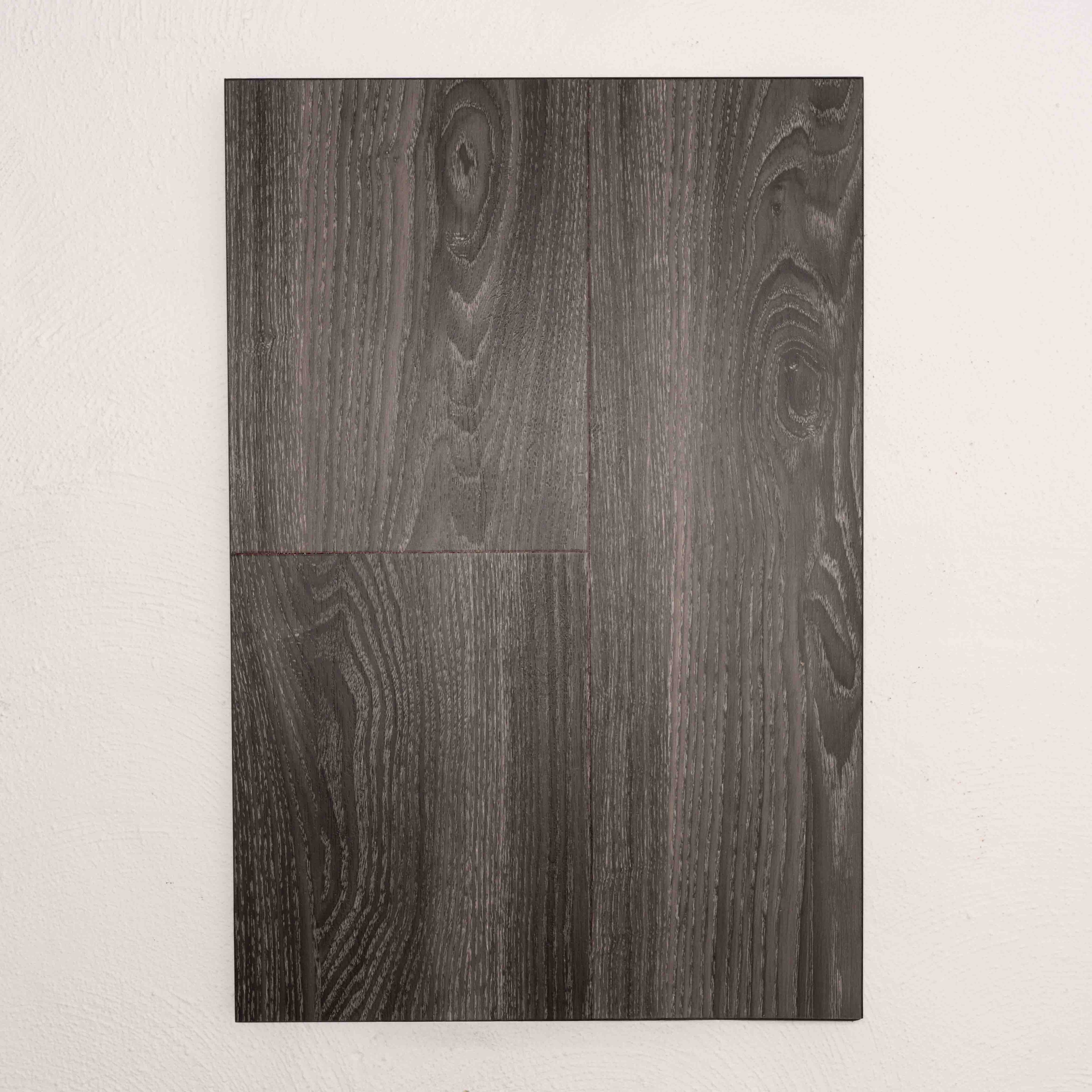 Flat lay of Midnight Oak Sterling Vinyl Plank 1220x229x3mm in Midnight Oak colour dark shade vinyl flooring plank sample