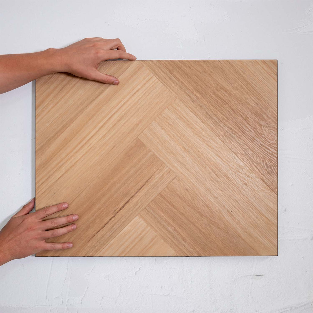 Perspective view of Natural Blackbutt SPC Hybrid Floorboards Herringbone 7.5+2mm in Natural Blackbutt colour dark shade herringbone flooring sample