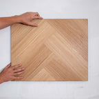 Perspective view of Natural Blackbutt SPC Hybrid Floorboards Herringbone 7.5+2mm in Natural Blackbutt colour dark shade herringbone flooring sample