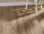 Side view of Natural Oak Urban Laminate Floors 12mm in Natural Oak colour warm tone flooring sample