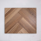 Close-up of Natural Spotted Gum SPC Hybrid Floorboards Herringbone 7.5+2mm in Natural Spotted colour warm tone herringbone flooring sample