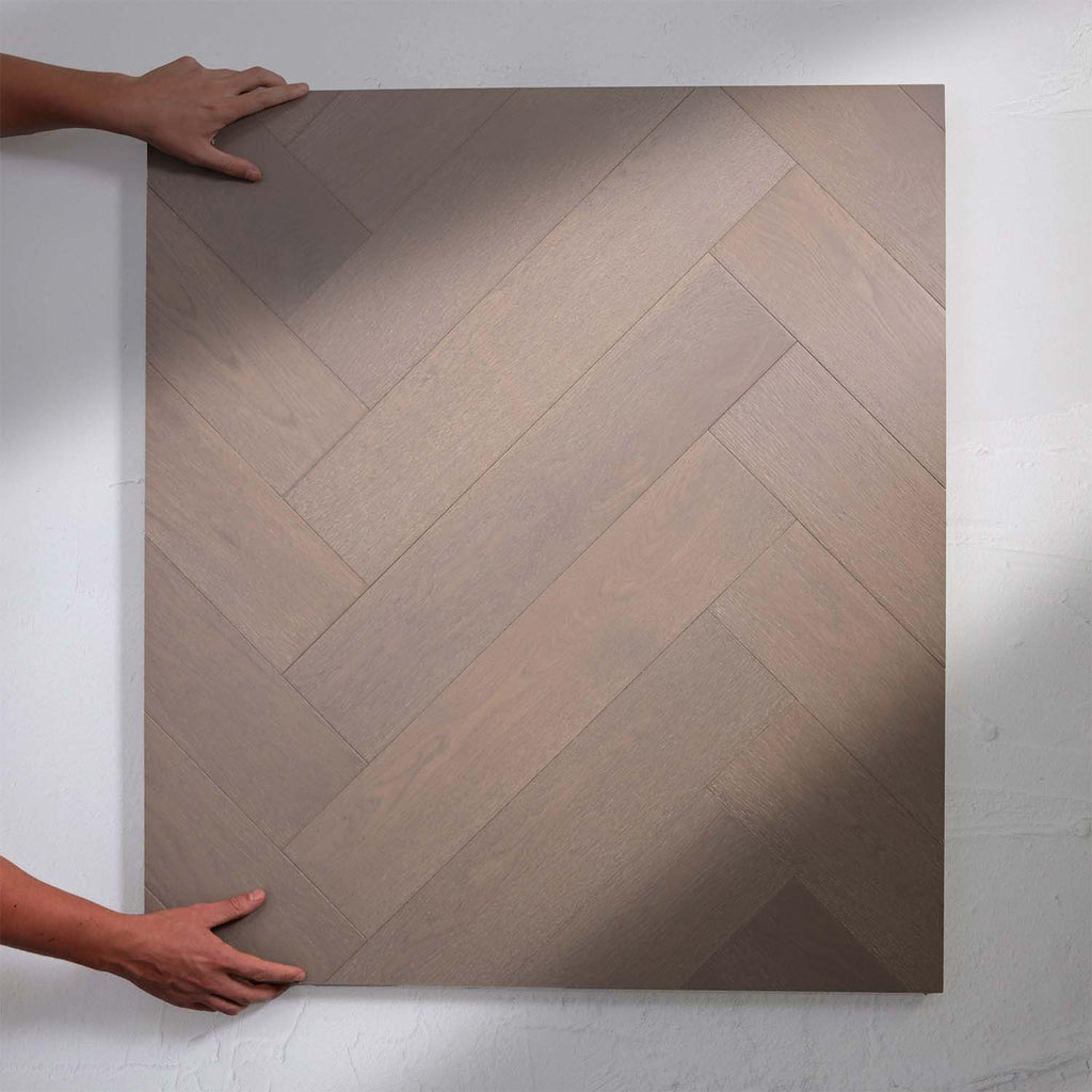 Top-down view of Pale Oak Engineered Timber Herringbone 15.3mm in Pale Oak colour warm tone herringbone flooring sample