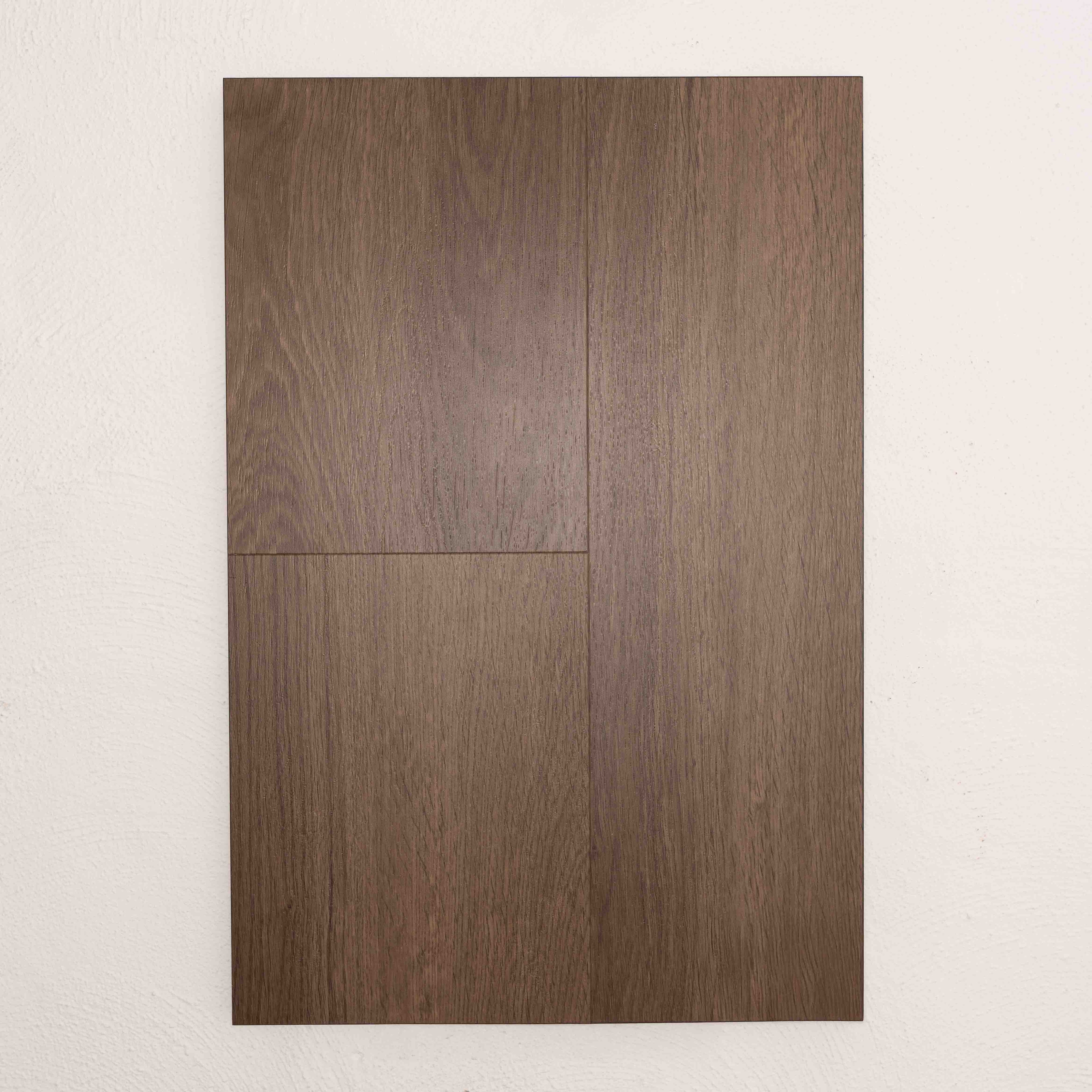 Angled view of Saddle Oak Vision Vinyl Planks 5mm in Saddle Oak colour warm tone vinyl flooring plank sample