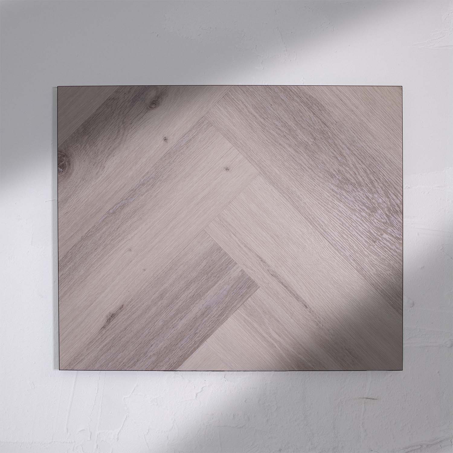 Full view of Snow Grey SPC Hybrid Floorboards Herringbone 7.5+2mm in Snow Grey colour light tone herringbone flooring sample