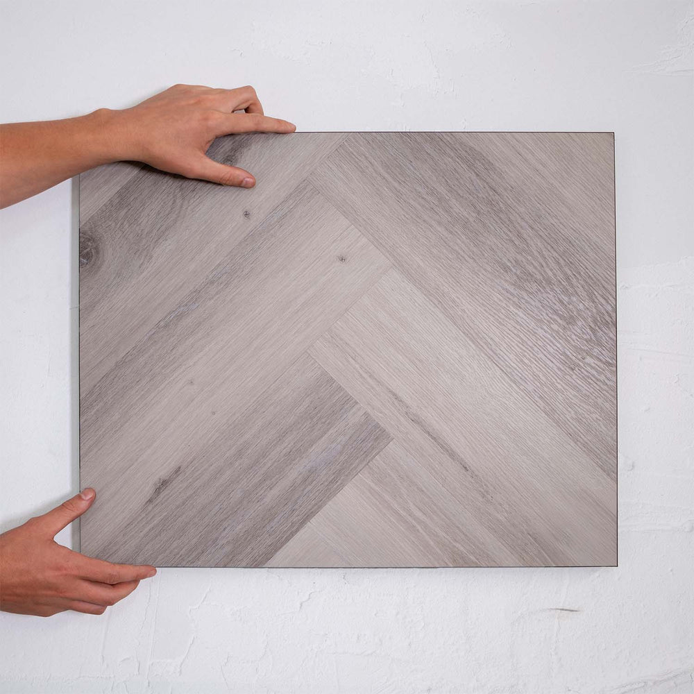 Side view of Snow Grey SPC Hybrid Floorboards Herringbone 7.5+2mm in Snow Grey colour light tone herringbone flooring sample