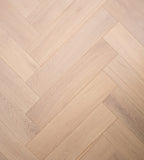 Close-up of Natural Limed Engineered Timber Herringbone 15.3mm in Natural Limed colour warm tone herringbone flooring sample