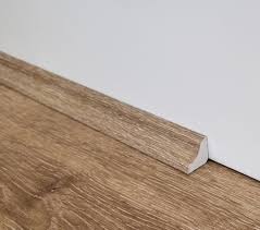 Side view of Scotia 2400x28x15mm in Ivory Beige colour warm tone flooring trim