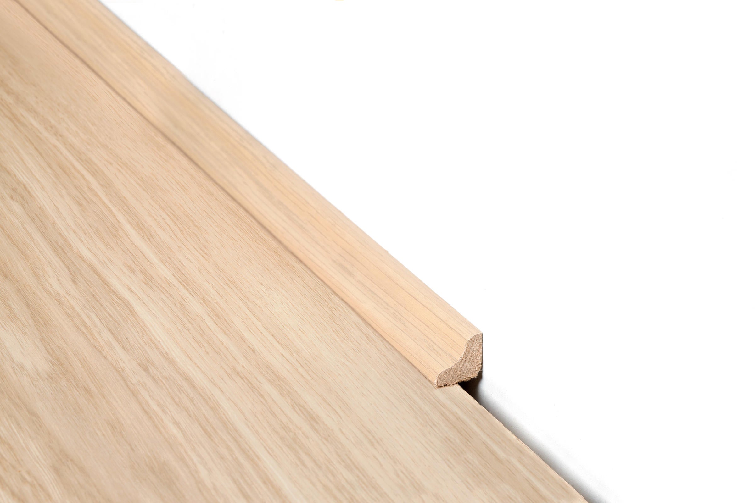 Flat lay of Scotia 2400x28x15mm in Natural Blackbutt colour dark shade flooring trim