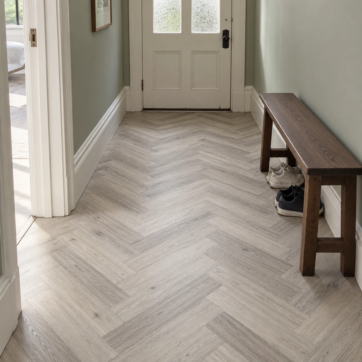Snow Grey 9.5mm herringbone hybrid flooring in an Australian entrance hall