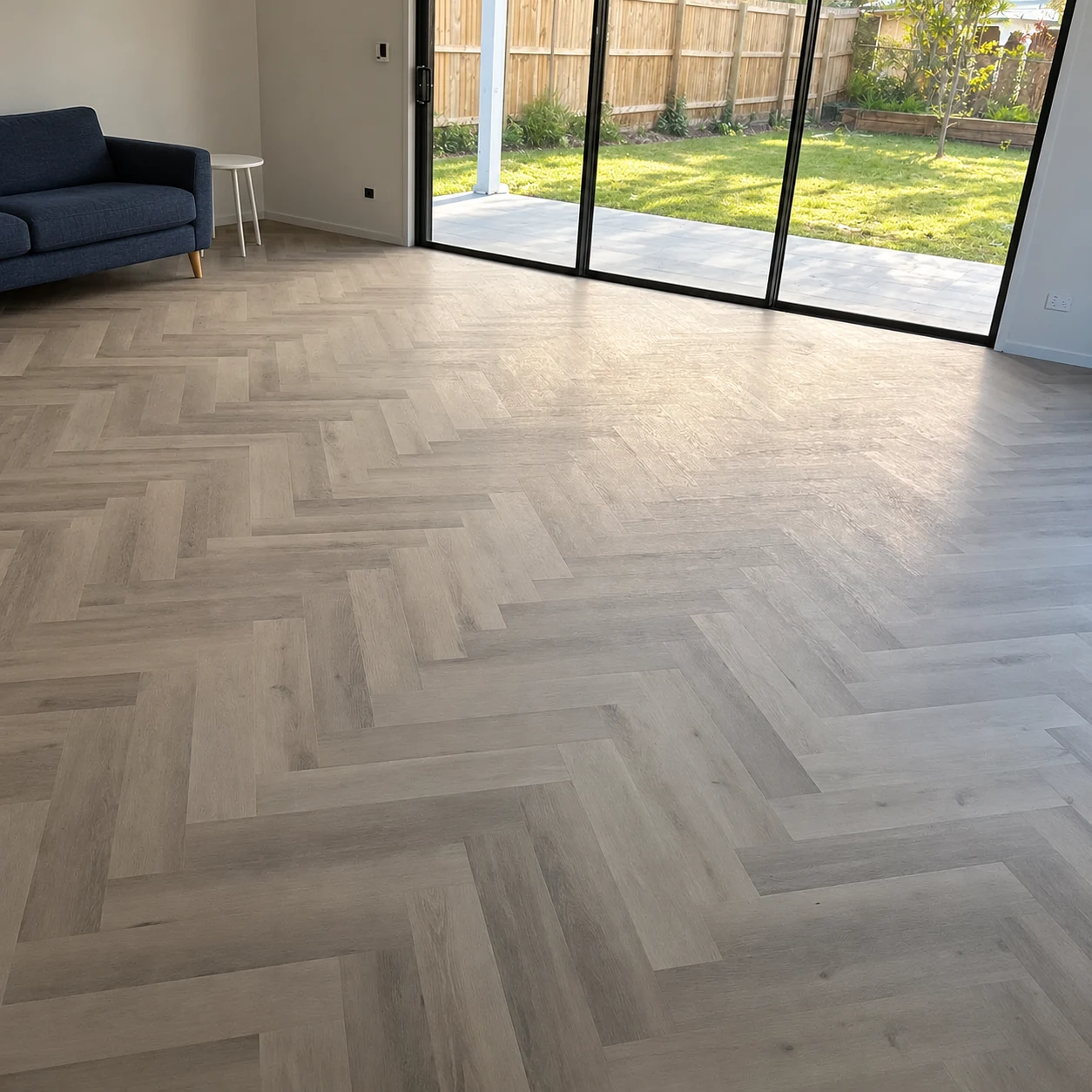 Snow Grey 9.5mm herringbone hybrid flooring in an Australian living room