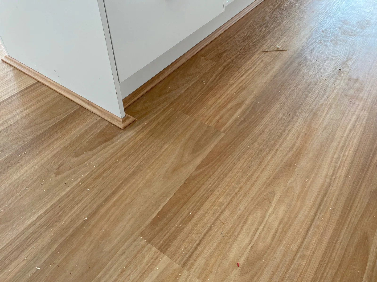 Natural Blackbutt 9.5mm hybrid flooring along a hallway in natural light