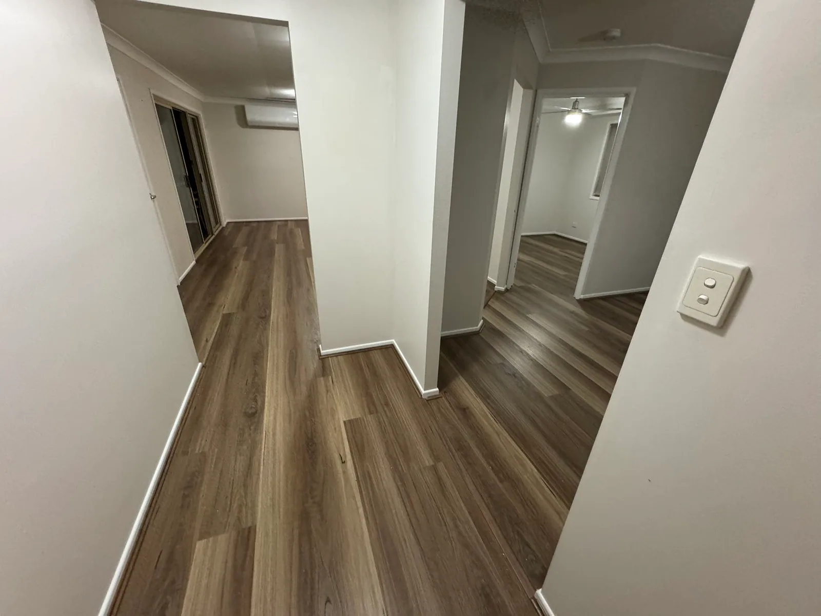 Natural Spotted Gum 9.5mm hybrid flooring around several doorways