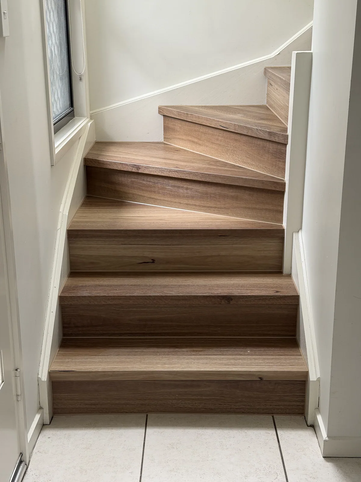QLD Spotted Gum 6.5mm hybrid flooring on a turning staircase