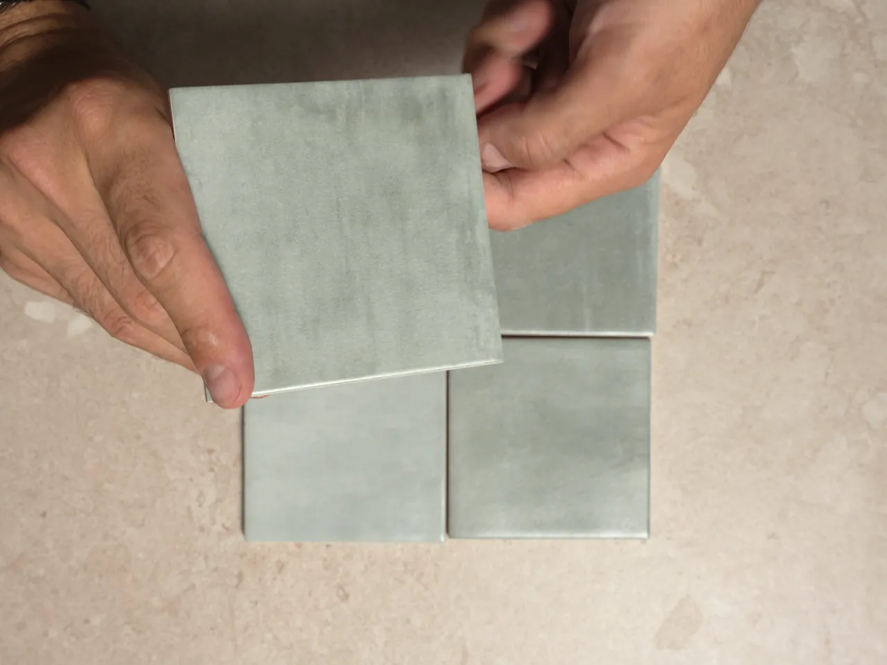 Chroma Celadon matte 100x100mm square wall tiles shown in a five-second video